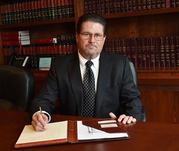 Adam Chrzan in the conference room of his law firm
